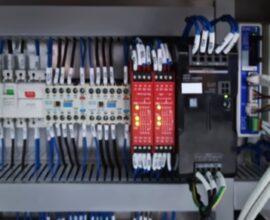 Power 4 Blurred Background of Switches and Wiring Inside of Electrical Control Cabinet