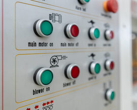 Power button on panel control machine. Pressing work button. Engineering are working on turning on machines in industrial plants.