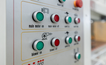Oil 3 Power button on panel control machine. Pressing work button. Engineering are working on turning on machines in industrial plants.